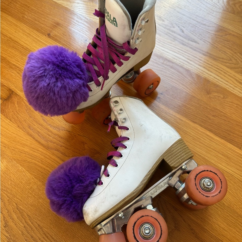 White Roller Skates with Purple Pom Poms
